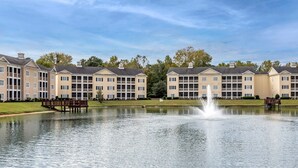 A row of multi-story buildings with a central water feature. - Bluegreen Vacations Harbour Lights, an Ascend Collection Resort (Myrtle Beach)