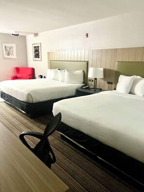 Premium bedding, desk, laptop workspace, soundproofing
