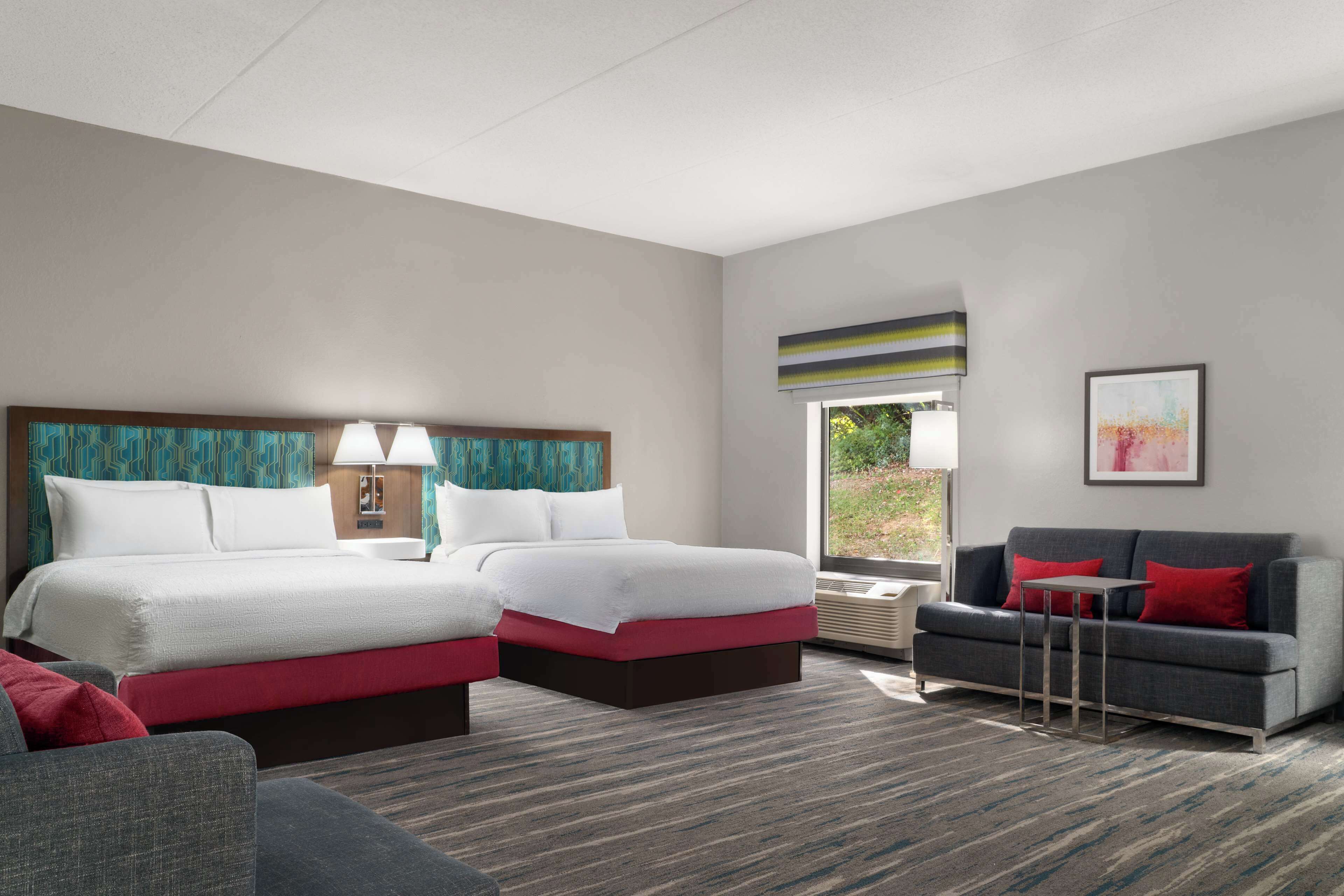 studio, 2 queen beds | living area | 55-inch led tv with cable channels, tv