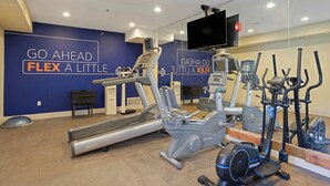 A gym with cardio machines, a treadmill, and a wall with motivational text. - Holiday Inn Express Hotel & Suites Torrington by IHG (Torrington)