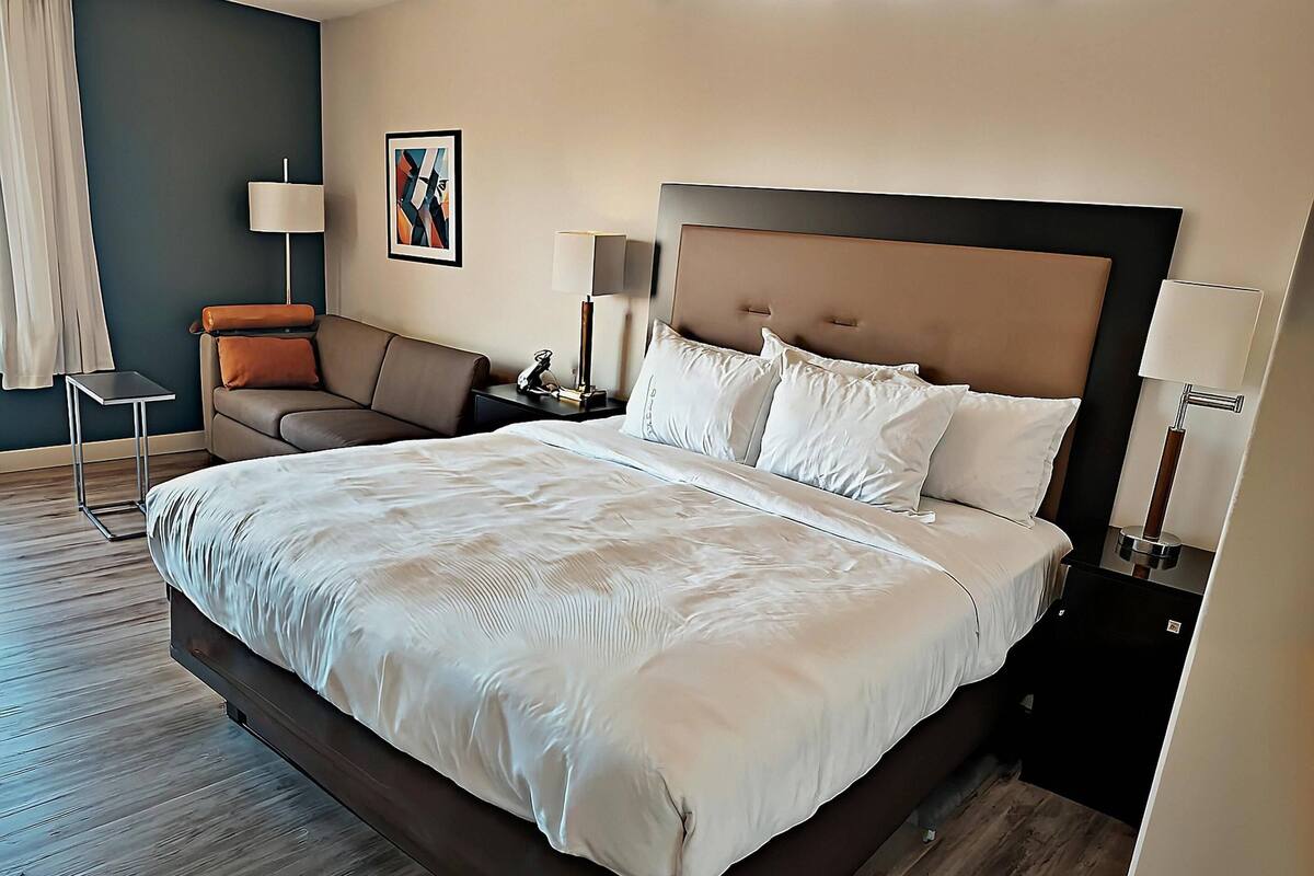 Suite, 1 King Bed with Sofa bed, Non Smoking | Pillowtop beds, desk, iron/ironing board, free cribs/infant beds