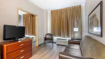 Desk, laptop workspace, blackout drapes, iron/ironing board