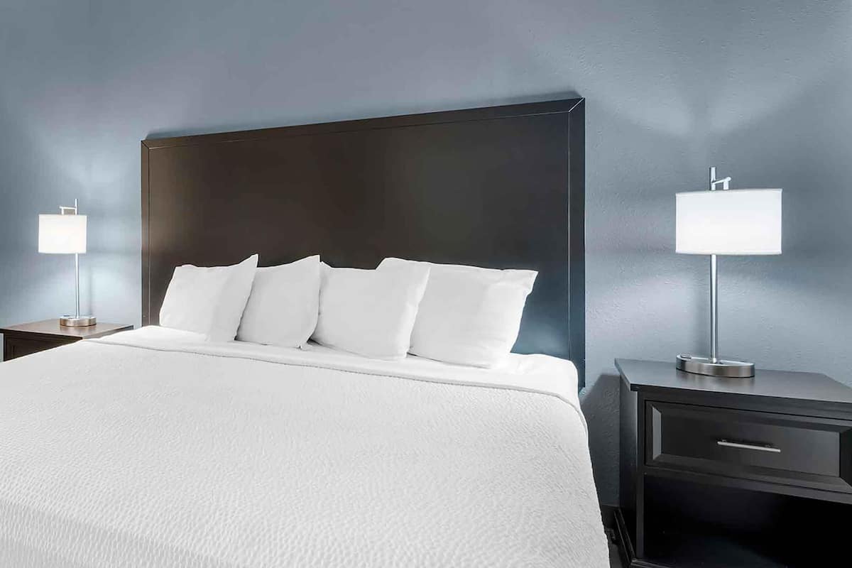 desk, laptop workspace, blackout curtains, iron/ironing board