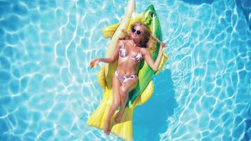 Outdoor pool, open 8:00 AM to 8:00 PM, free cabanas, pool umbrellas