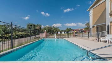 Seasonal outdoor pool, pool loungers