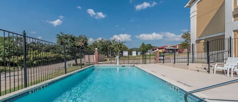 Seasonal outdoor pool, pool loungers