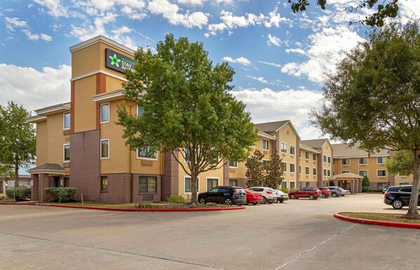 A Holiday Inn Express hotel with a parking lot and several cars parked. - Extended Stay America Suites Houston NASA Johnson Space Ctr (Houston)