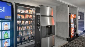A vending machine area with snacks and beverages.