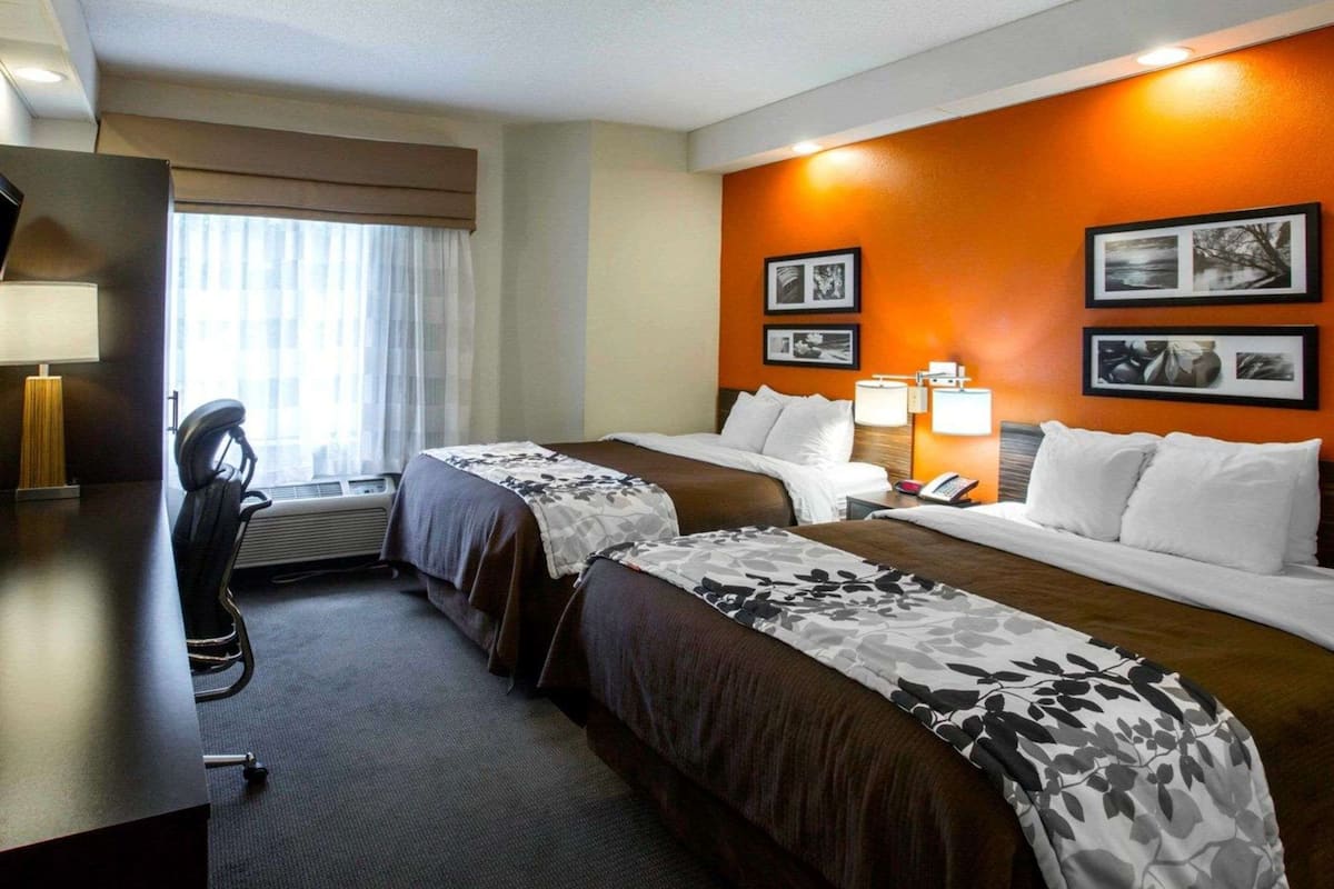 Premium bedding, pillow-top beds, desk, laptop workspace
