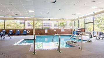 Indoor pool, open 10:00 AM to 10:00 PM, pool loungers