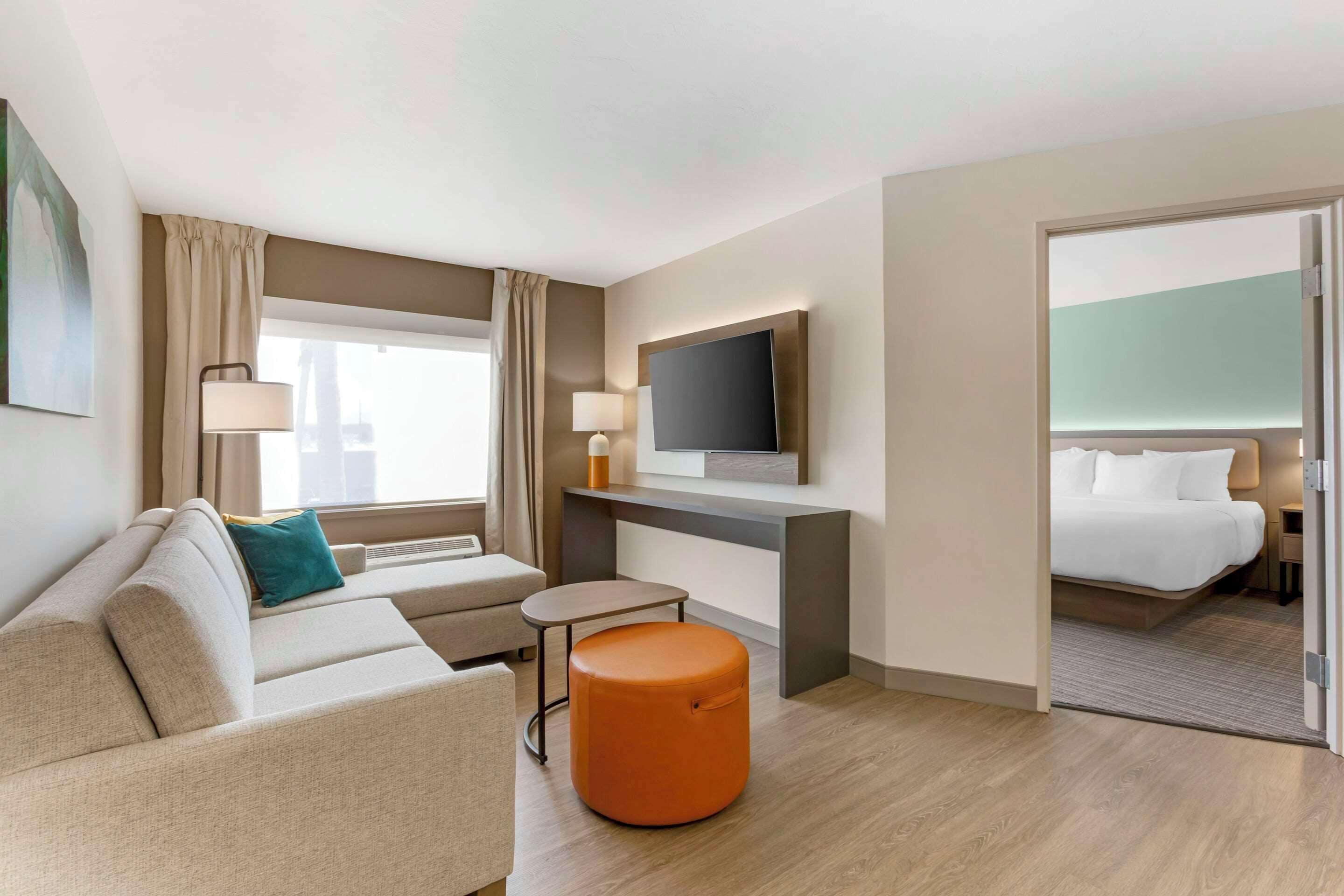 premium bedding, desk, laptop workspace, blackout curtains