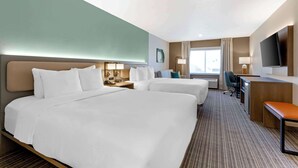 A hotel room with two beds, a desk, a chair, a TV, and a window. - Comfort Suites At Tucson Mall (Tucson)