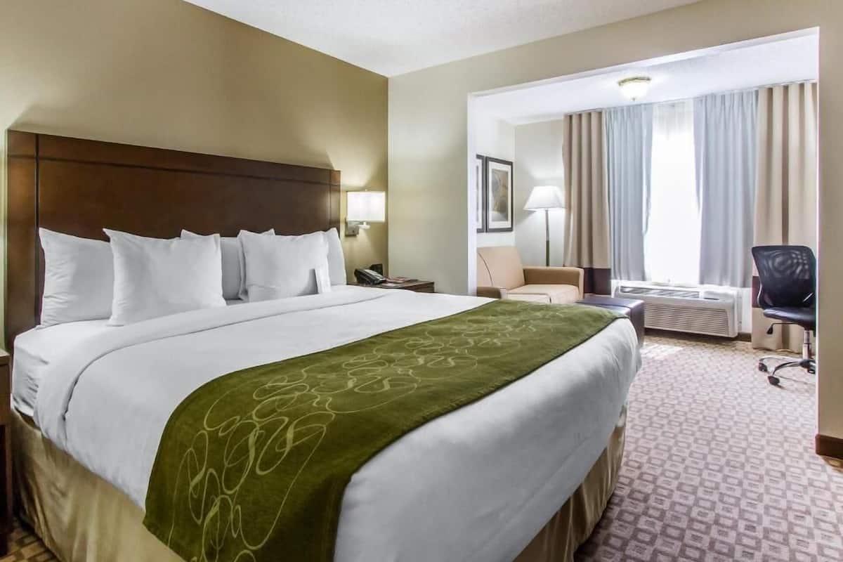 Premium bedding, desk, laptop workspace, blackout drapes