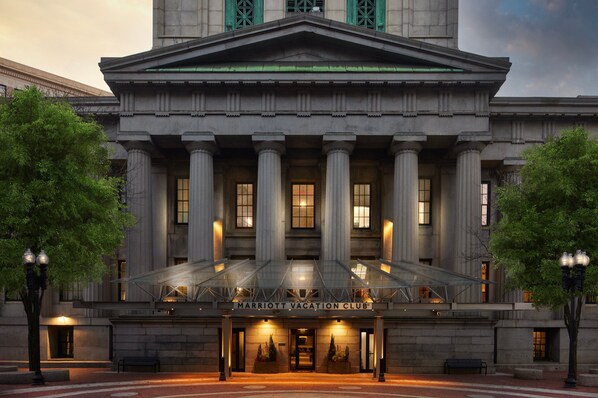 A grand building with a large entrance, columns, and a sign reading "Marriott Vacation Club".