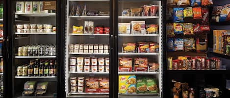 A refrigerated display case in a store with various food products.