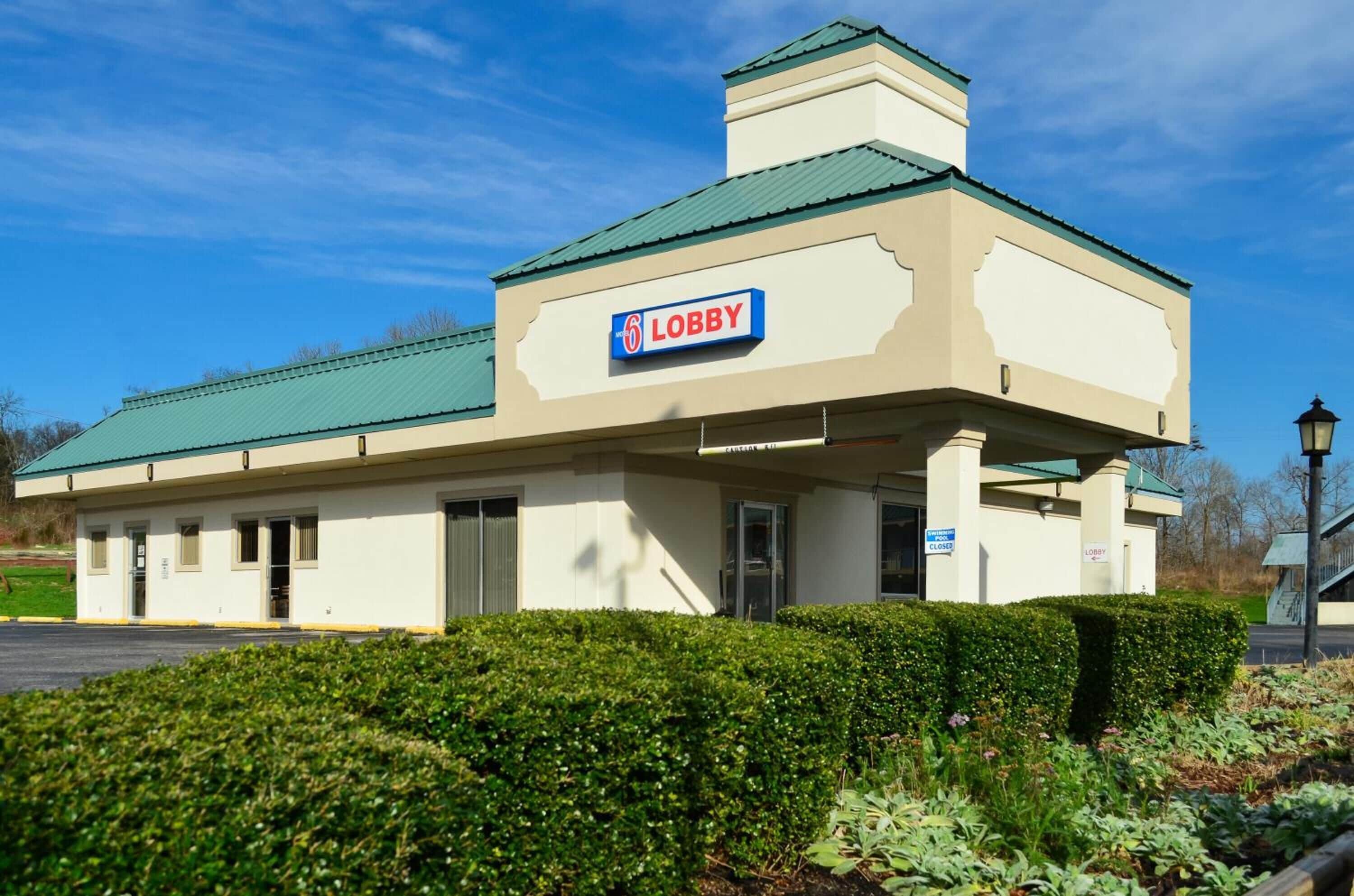 A building with a sign reading "6 Lobby" and a closed sign.