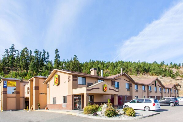 Situated in a natural setting, this motel offers a simple, functional design with a central entrance and covered porch.
