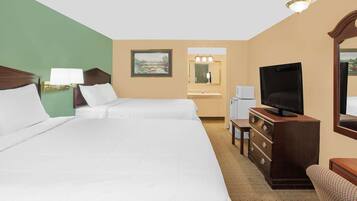 A hotel room with two beds, a television, a dresser, a mirror, and a painting on the wall.