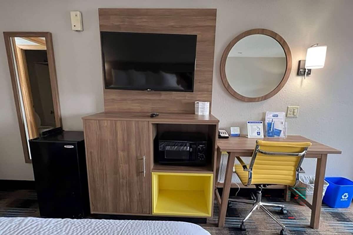Desk, laptop workspace, blackout drapes, iron/ironing board