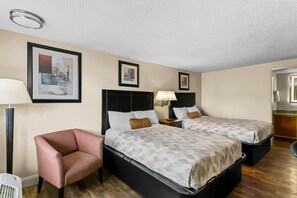 Room, 2 Double Beds | Desk, blackout drapes, iron/ironing board, cribs/infant beds