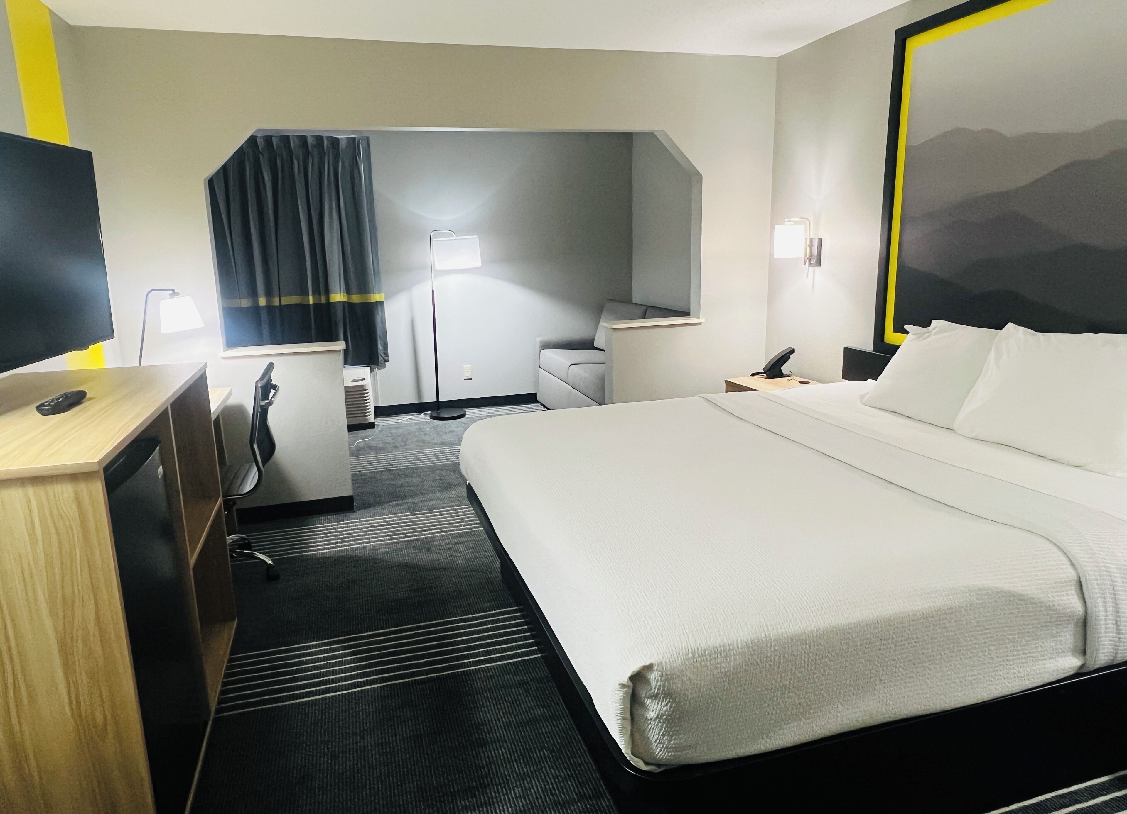 Suite, 1 King Bed with Sofa bed, Non Smoking | Blackout drapes, soundproofing, iron/ironing board, WiFi