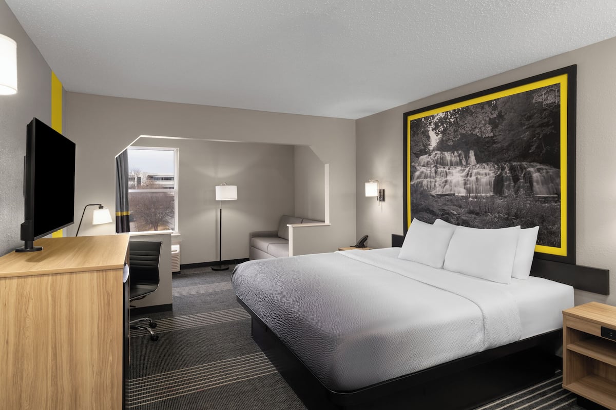 Suite, 1 King Bed with Sofa bed, Non Smoking | Blackout drapes, soundproofing, iron/ironing board, WiFi