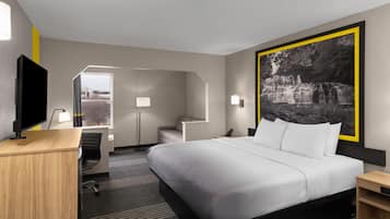 Suite, 1 King Bed with Sofa bed, Non Smoking | Blackout drapes, soundproofing, iron/ironing board, WiFi