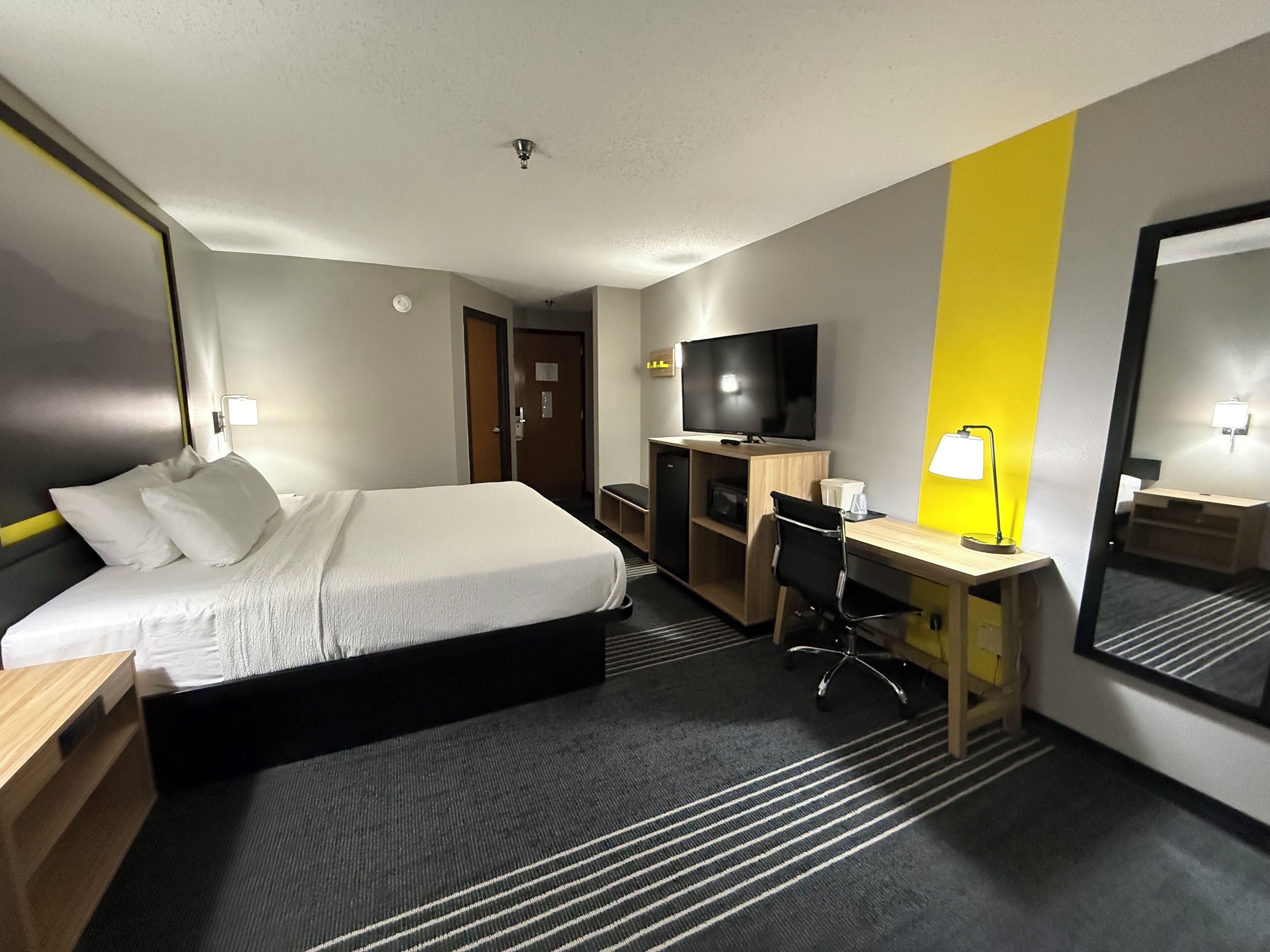 Suite, 1 King Bed with Sofa bed, Non Smoking | Blackout drapes, soundproofing, iron/ironing board, WiFi