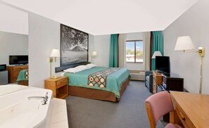 Suite, 1 King Bed, Hot Tub | Desk, laptop workspace, blackout drapes, iron/ironing board