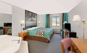 Suite, 1 King Bed, Hot Tub | Desk, laptop workspace, blackout drapes, iron/ironing board