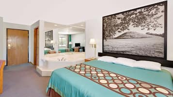 Suite, 1 très grand lit, baignoire à remous | Bureau, espace de travail pour ordinateurs portables