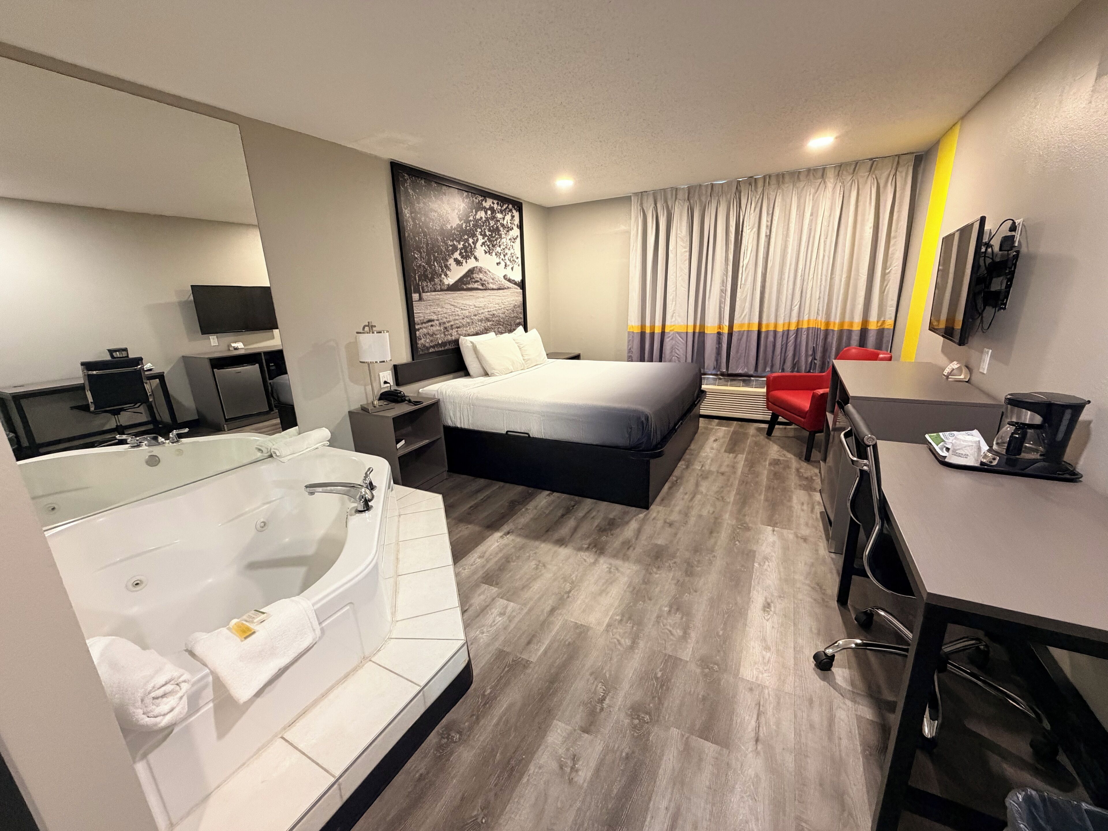Suite, 1 King Bed, Hot Tub | Desk, laptop workspace, blackout drapes, iron/ironing board