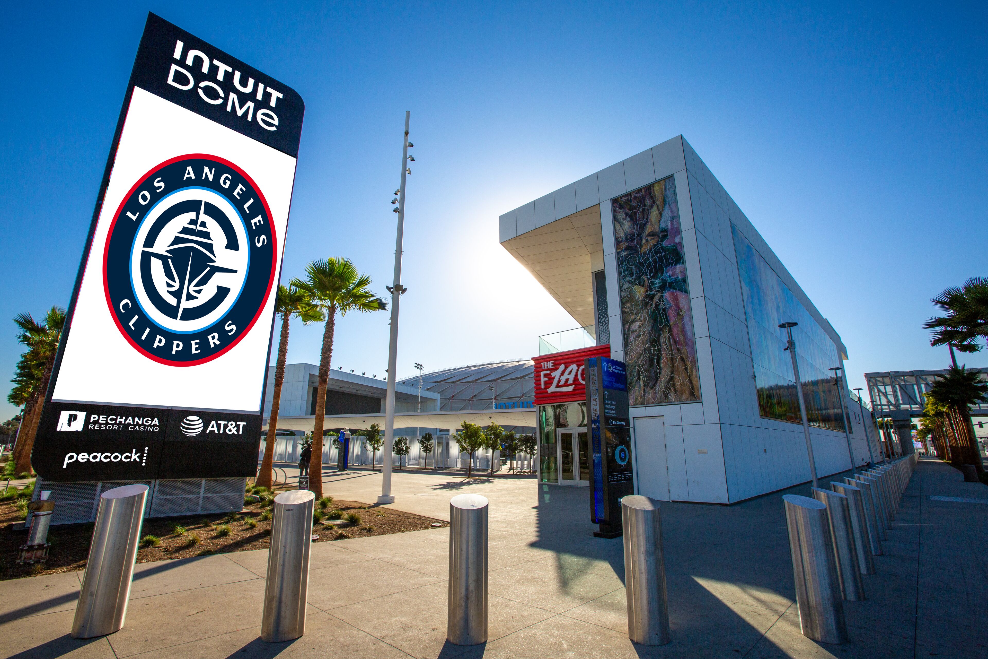 A modern building with a prominent sign for the Los Angeles Clippers, a Pechanga Resort Casino, and AT&T.