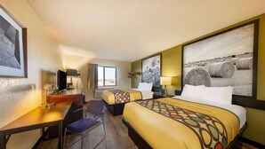 A hotel room with two beds, a desk, a chair, and a large framed picture on the wall. - Super 8 by Wyndham El Dorado (El Dorado)