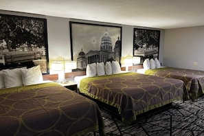 A hotel room with two beds, a large framed picture of a building, and a patterned carpet. - Super 8 by Wyndham Pella (Pella)
