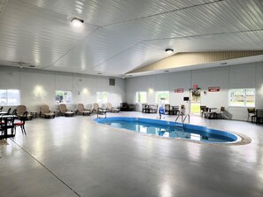 Indoor pool, open 9:00 AM to 9:00 PM, pool loungers