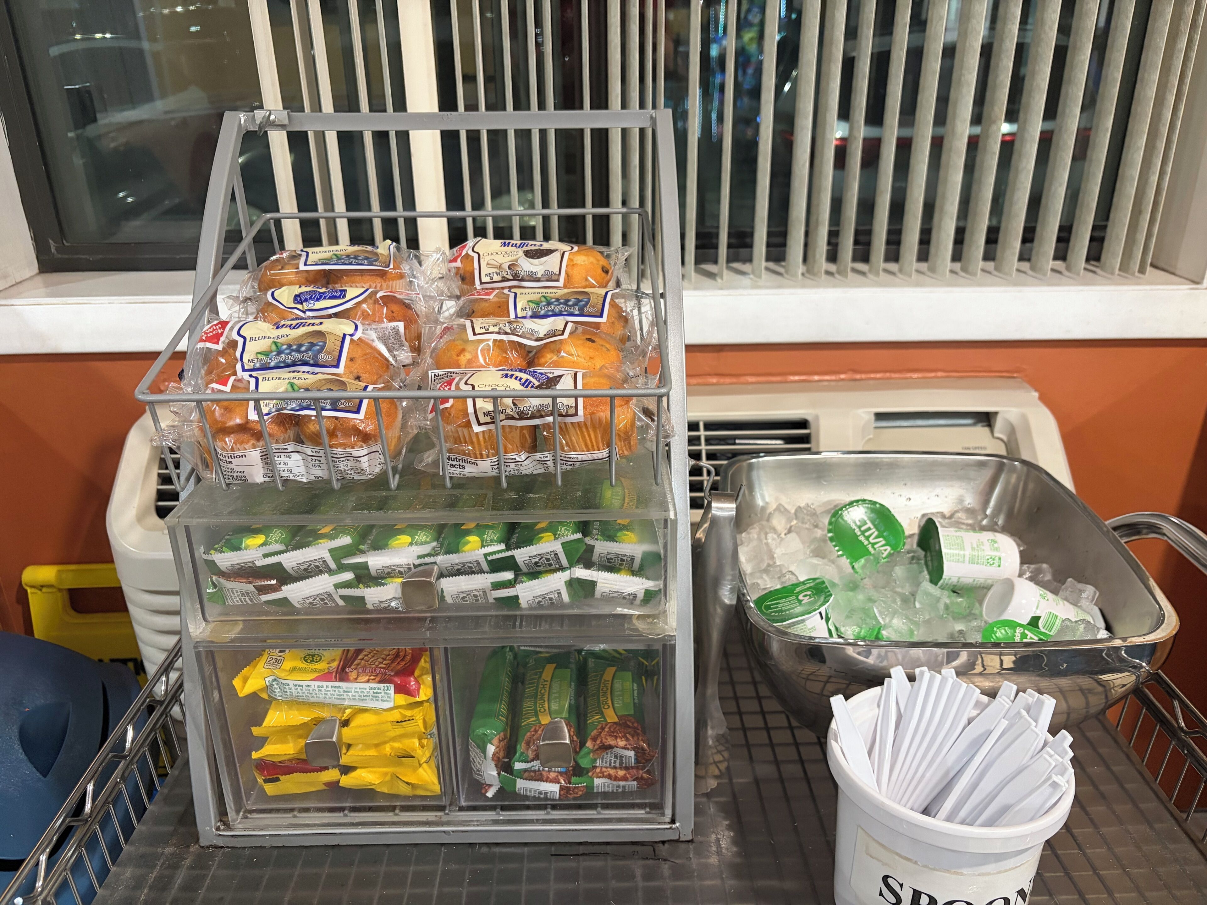 A refrigerated display with packaged snacks and beverages.