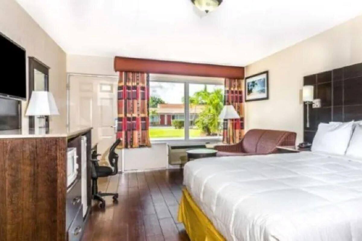 Desk, laptop workspace, blackout curtains, iron/ironing board