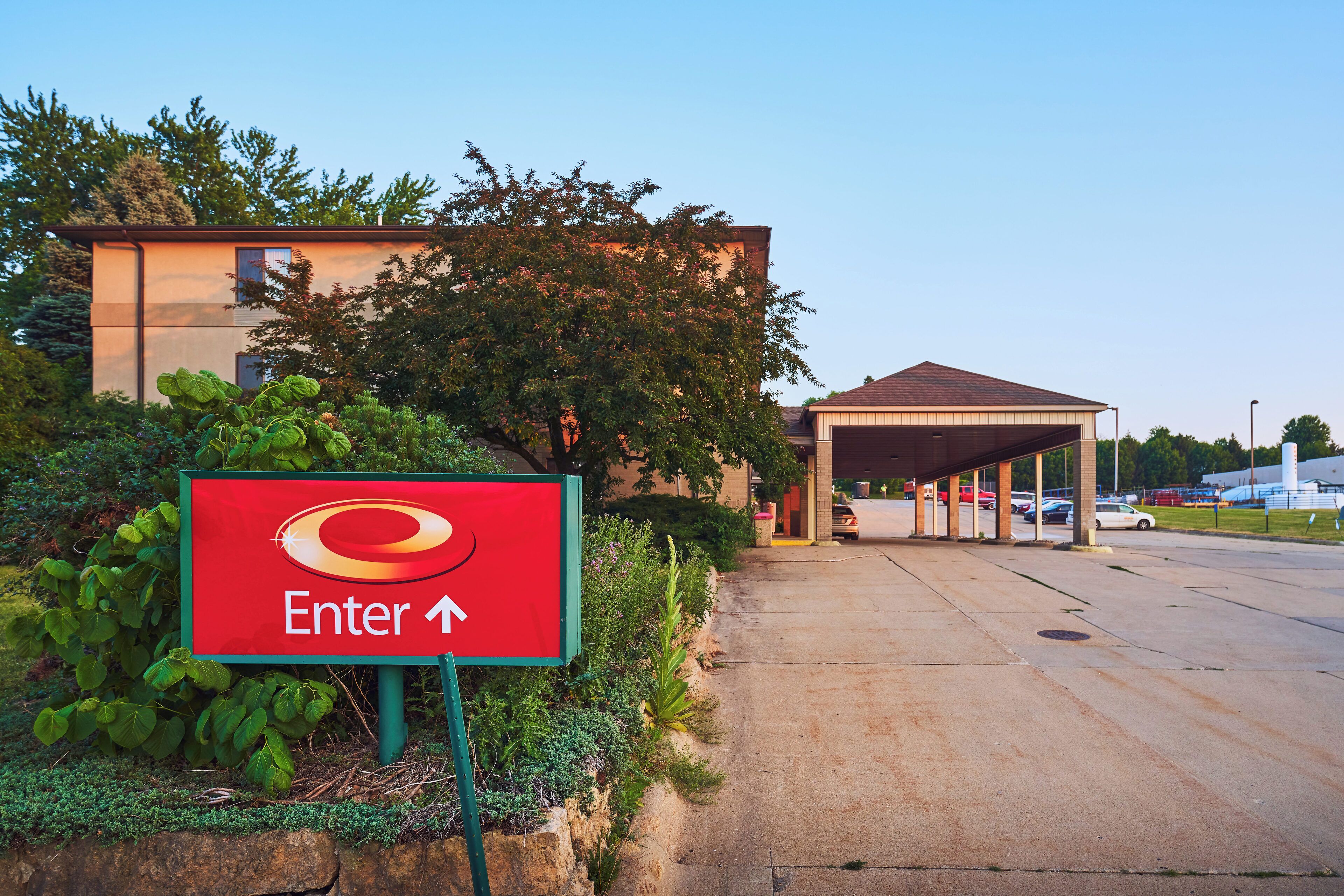 A red sign with an arrow pointing right, indicating an entrance direction.