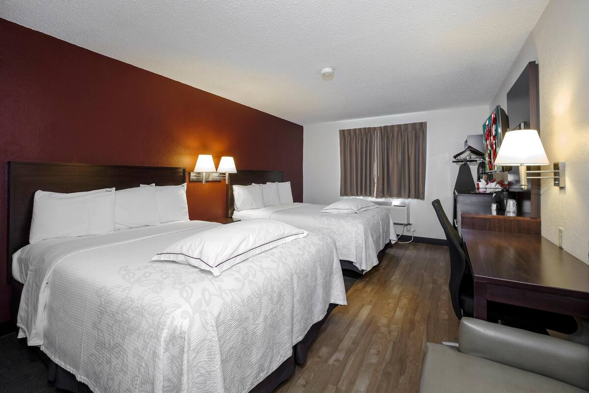 Blackout drapes, iron/ironing board, cribs (free), WiFi (free)