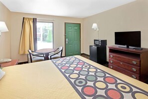 Desk, laptop workspace, blackout drapes, iron/ironing board