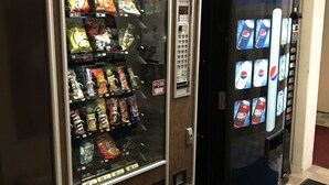 A vending machine with snacks and a Pepsi dispenser.