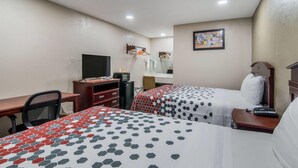 A hotel room with two beds, a desk, a chair, a TV, and a mirror. - Super 8 by Wyndham Waco North I-35 (Waco)