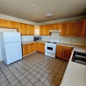 Suite, 1 King Bed, Non Smoking | Private kitchen | Fridge, microwave