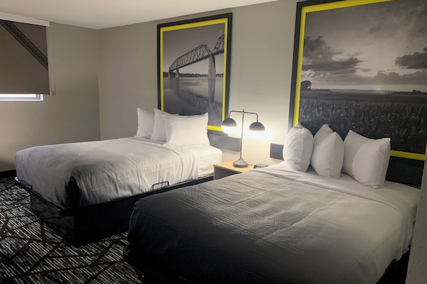 Pillow-top beds, desk, blackout curtains, free cots/infant beds