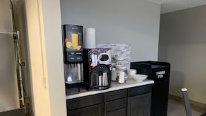 A kitchenette with a coffee machine, a paper towel dispenser, and a trash bin labeled "THANK YOU". - Super 8 by Wyndham Kirksville-University Area (Kirksville)