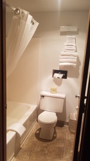 Suite, 1 Queen Bed, Non Smoking | Bathroom | Combined shower/tub, hair dryer, towels