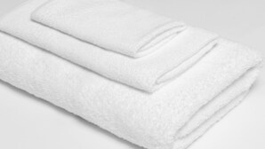 A neatly folded white towel. - Americas Best Value Inn Seward (Seward)