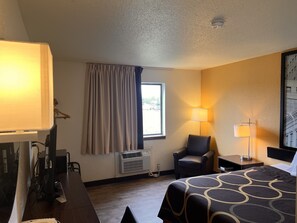 Premium bedding, desk, laptop workspace, blackout curtains
