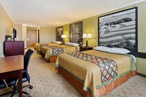 A hotel room with two beds, a desk, a chair, and a large landscape painting on the wall.